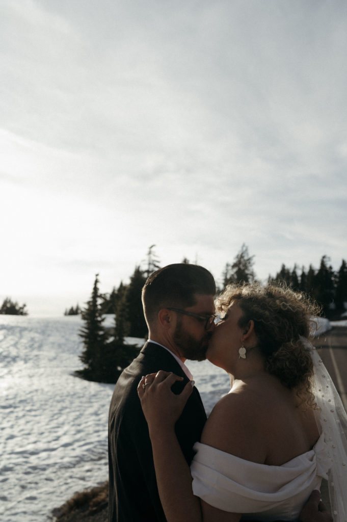 Couple kissing at sunset in Crater Lake National Park after Eloping 