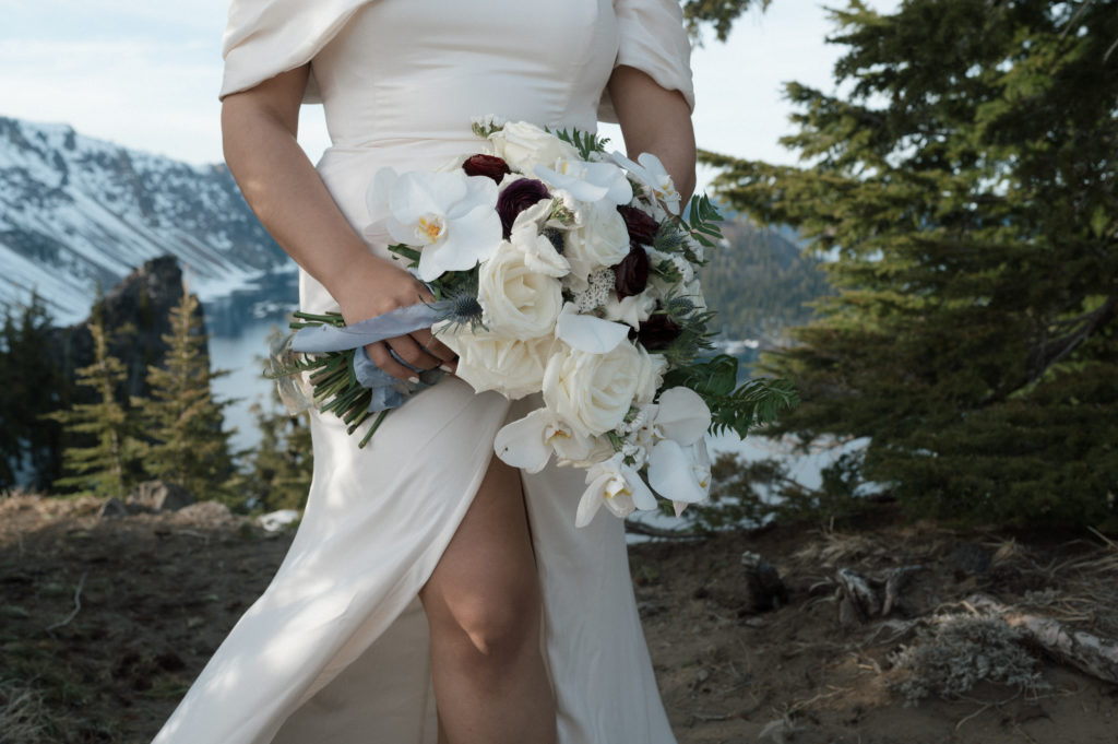Brides bouquet with roses and orchids at Oregon mountain elopement.