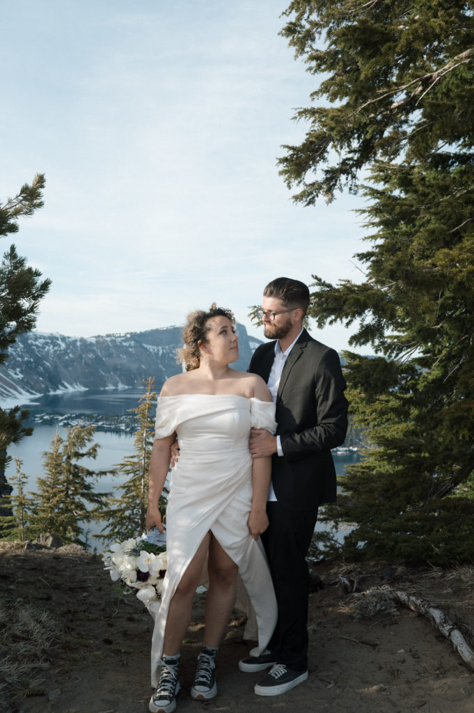 Couple posing after their elopement at Crater Lake National Park.