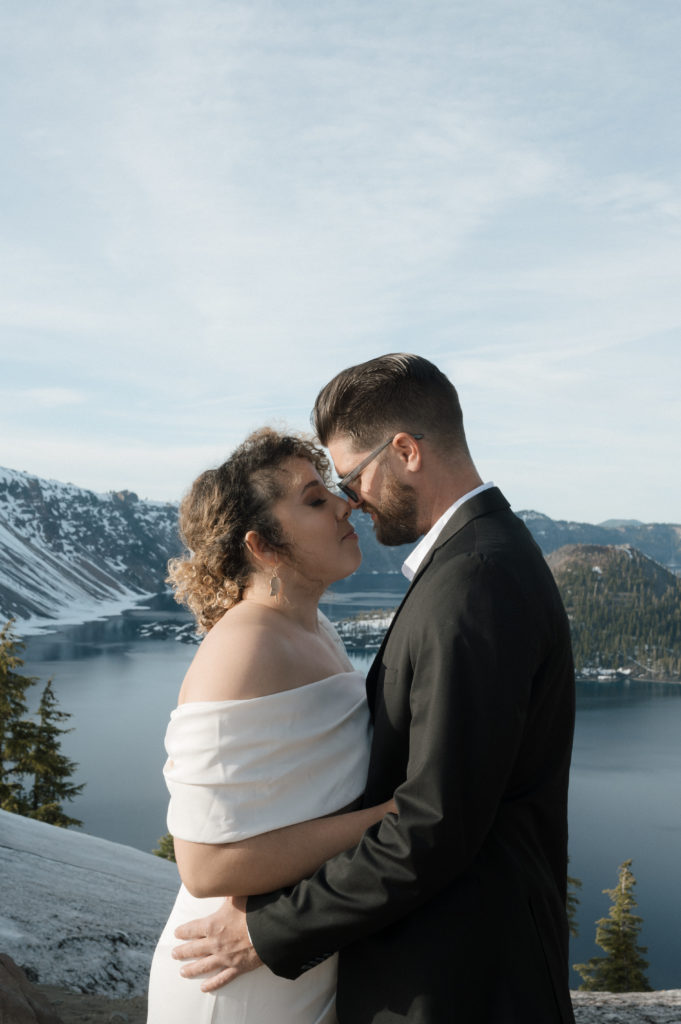Couple posing in front of Crater Lake