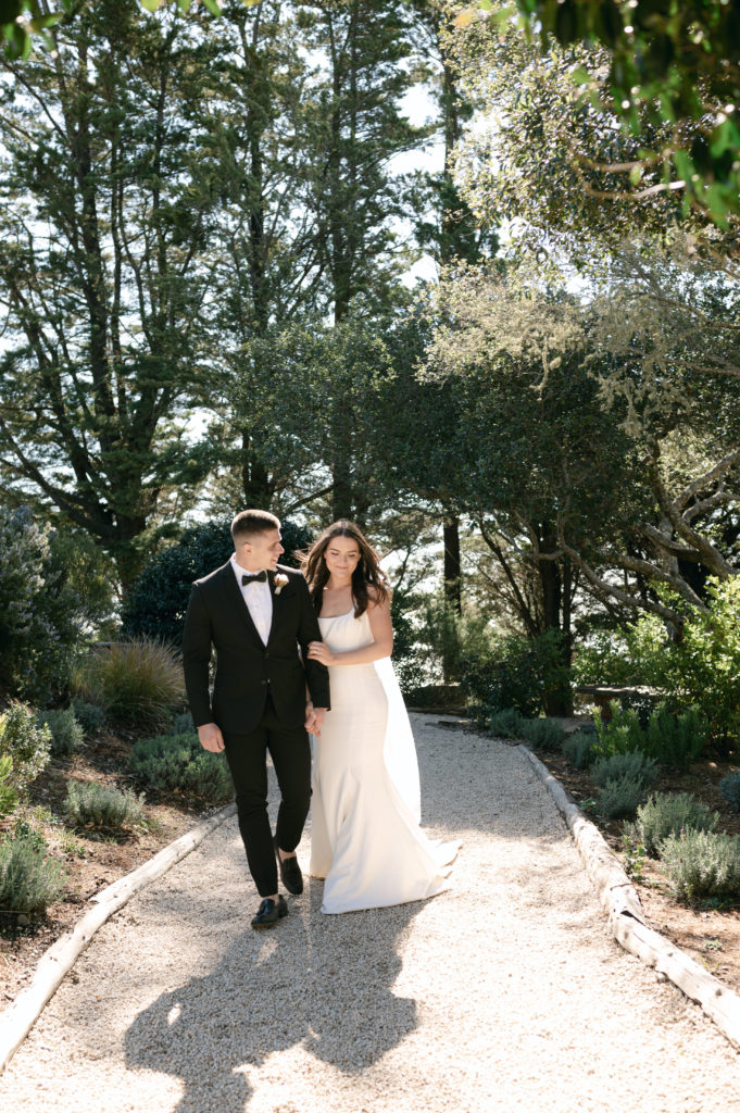 Couple walking down the path in Ventana Big Sur after getting married.