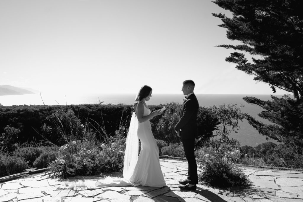 Couple says vows overlooking the coast in Big Sur in black and white