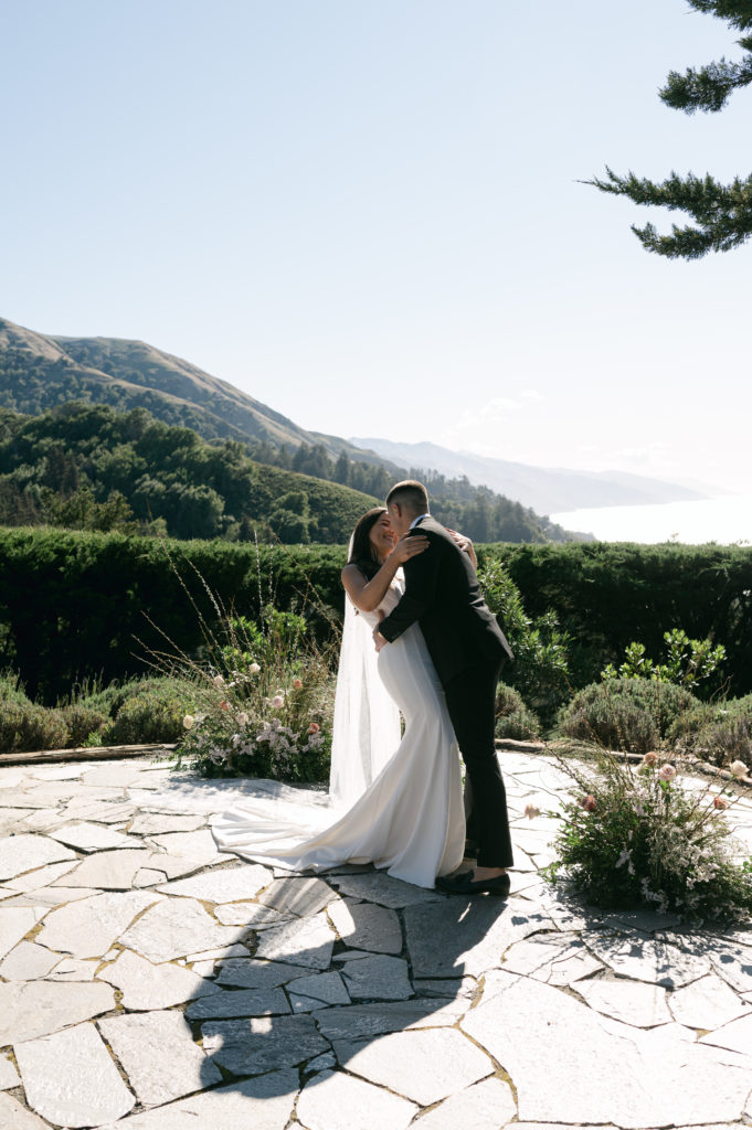 Couple kissing at micro wedding ceremony in Big Sur
