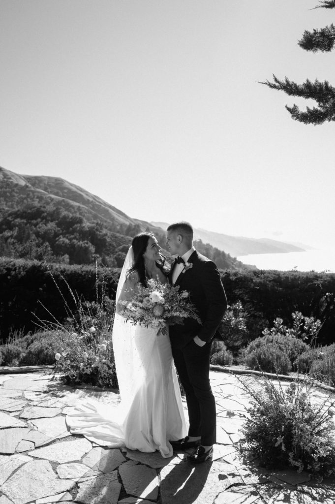 Black and white portrait of couple on the coast in Big Sur, California