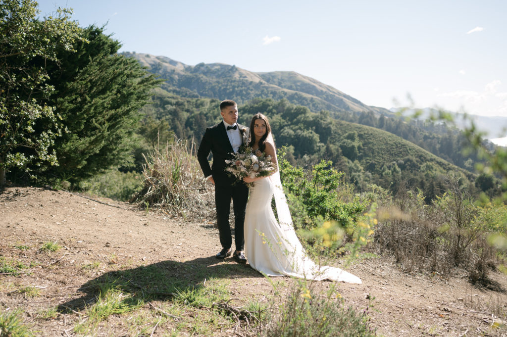 Couples portrait in front of the coastal mountains in Big Sur