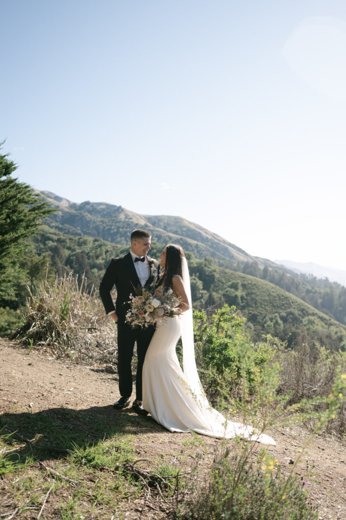 Couples portrait in front of the coastal mountains in Big Sur, California