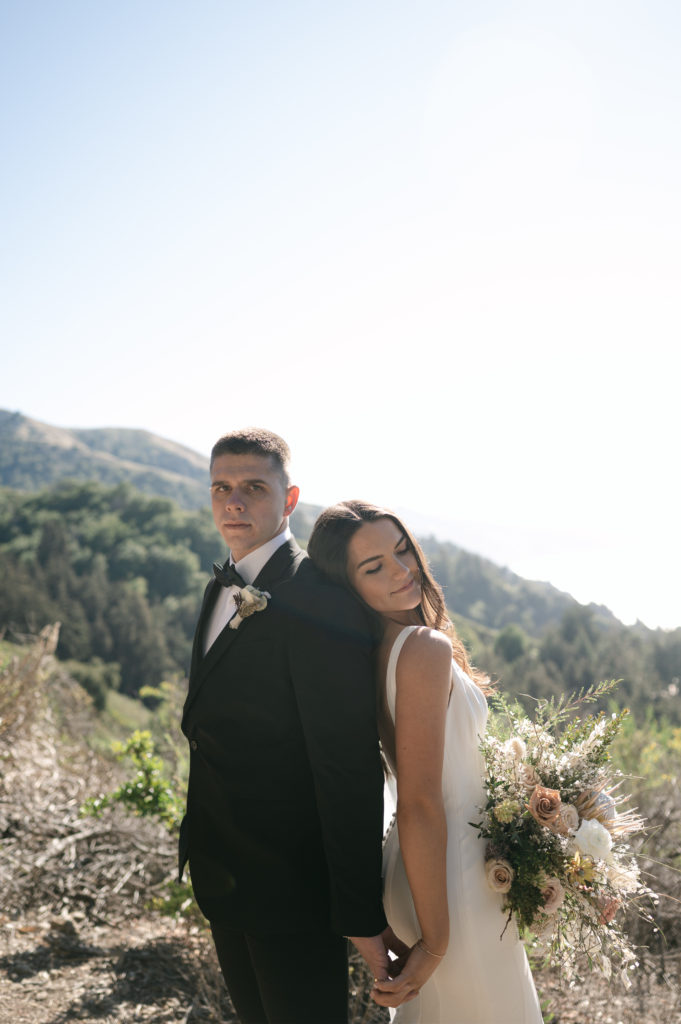 Couples portrait in front of the coastal mountains in Big Sur