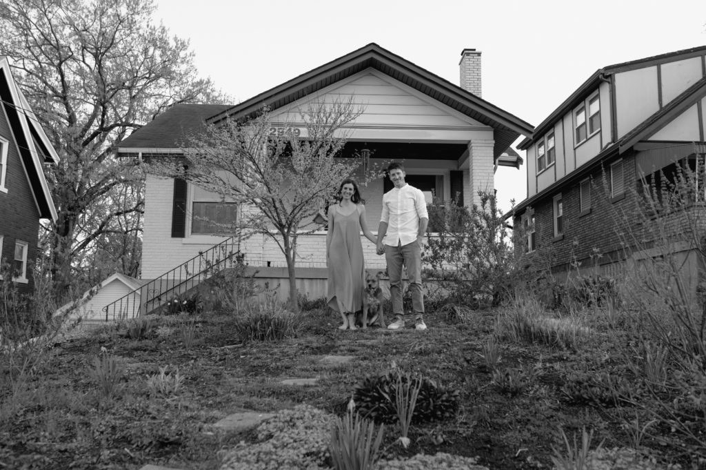 Couple smiling in front of their home in Cincinnati, Ohio.