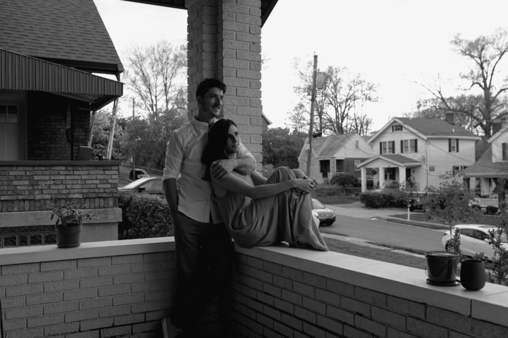 Black and white photo of couple on their front porch in Cincinnati 