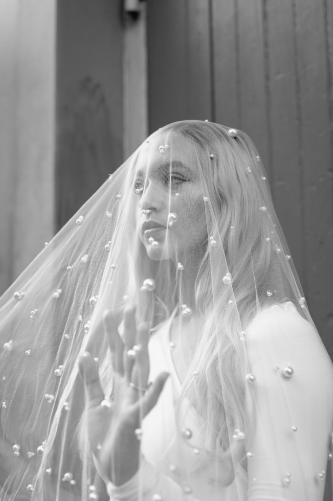 Black and white modern bridal portrait with beaded veil