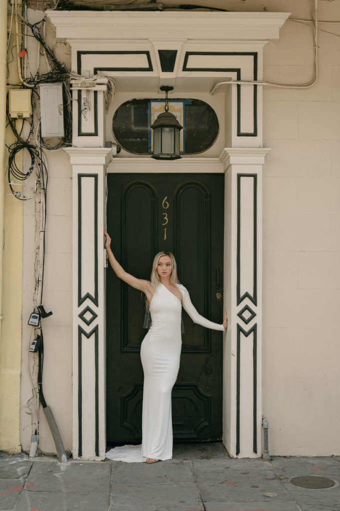 Bride modeling in doorway in New Orleans 