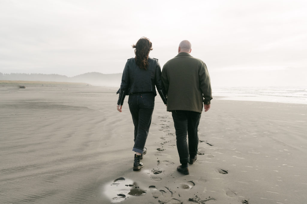 Couple walking on the beach in Seaview, Washington 