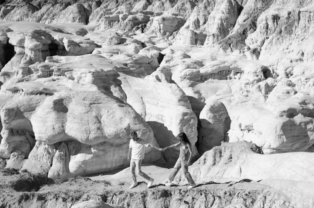 Couple walking through the Paint Mines in Colorado 