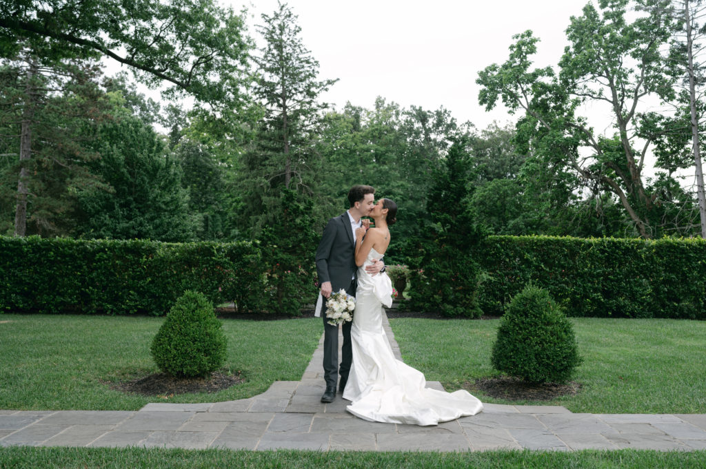 Luxury editorial bridal couple kissing at Pinecroft Mansion in Cincinnati, Ohio.