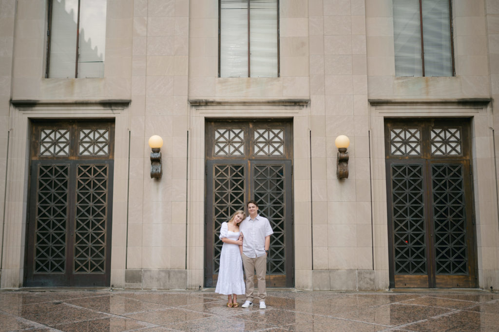 Bride and groom posing in front of iron doors downtown Nashville.