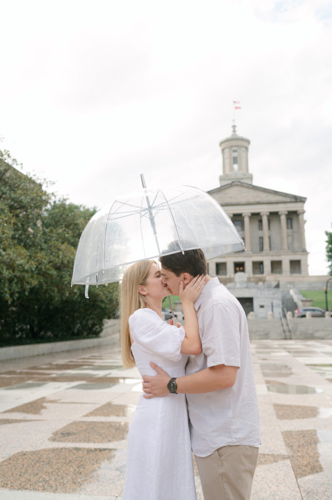 Couple kissing in the rain