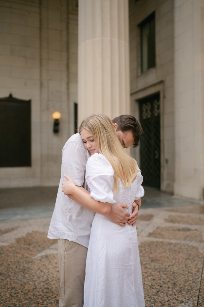 Couple hugging inside The War Memorial building in downtown Nashville
