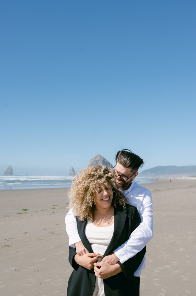 Couple posing at Cannon Beach 