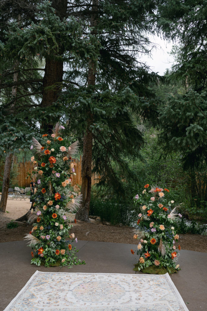 Floral backdrop set up for wedding ceremony 