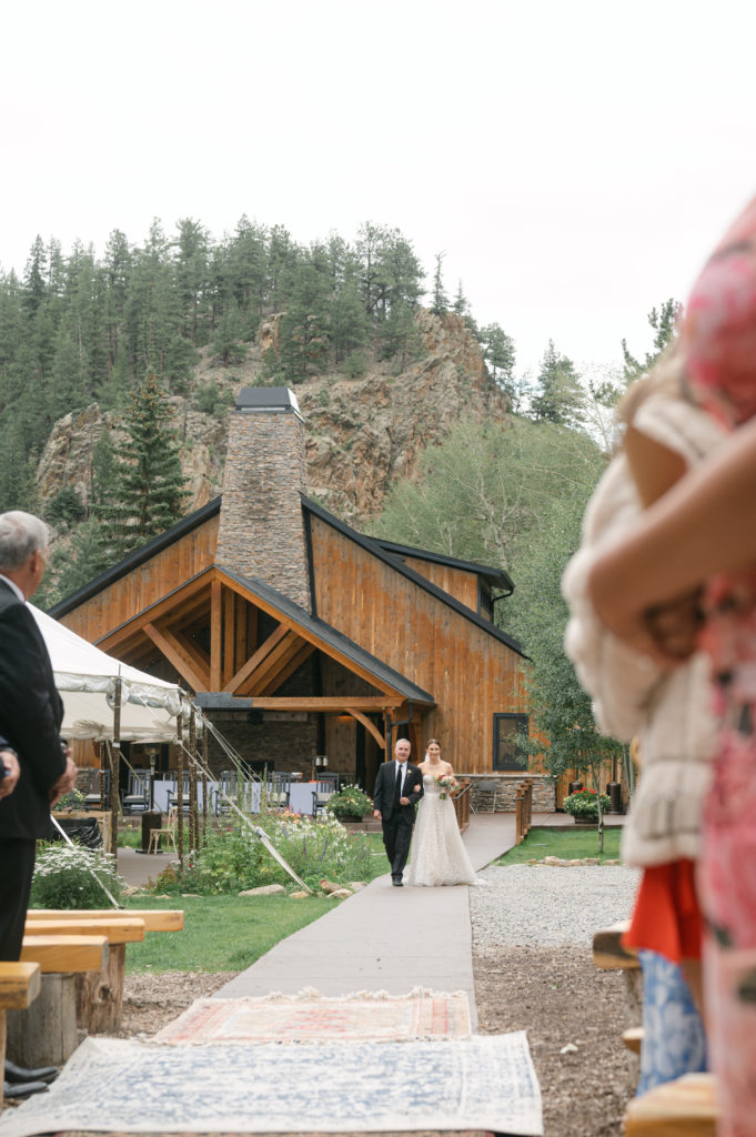 Father of the bride walking bride down the aisle at Blackstone Rivers Ranch 