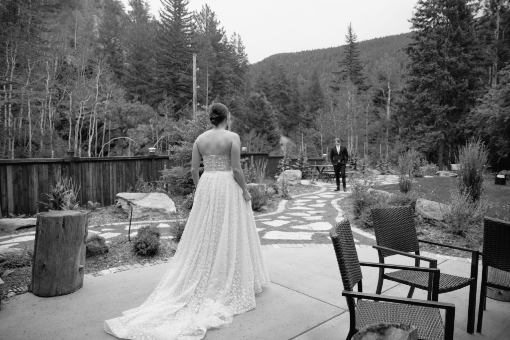 First look with bride and groom in black and white 