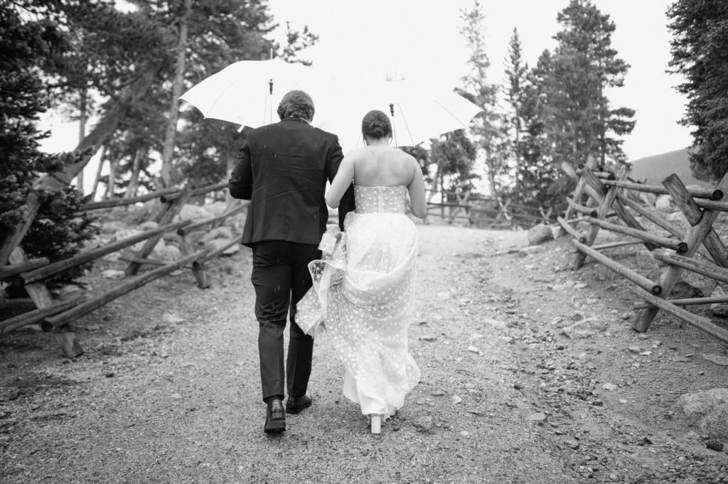 Bride and groom walking to portraits. 
