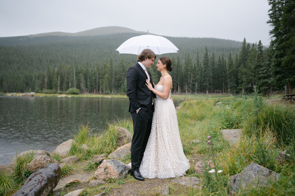 Bride and groom posing for romantic portrait at echo lake 