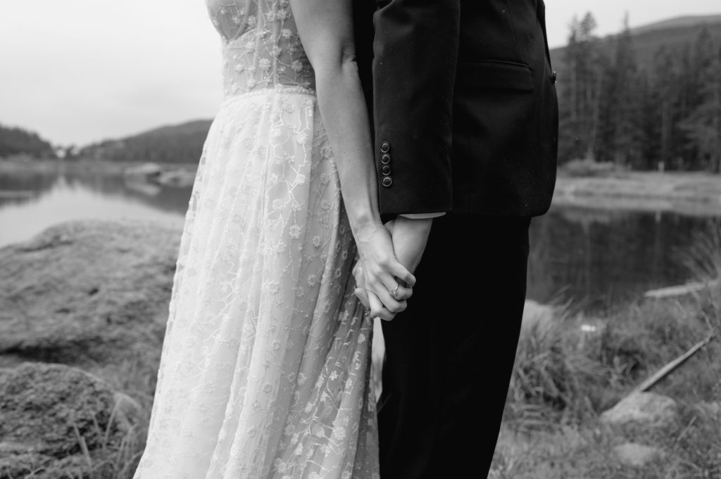 romantic detail shot of bride and grooms hands 