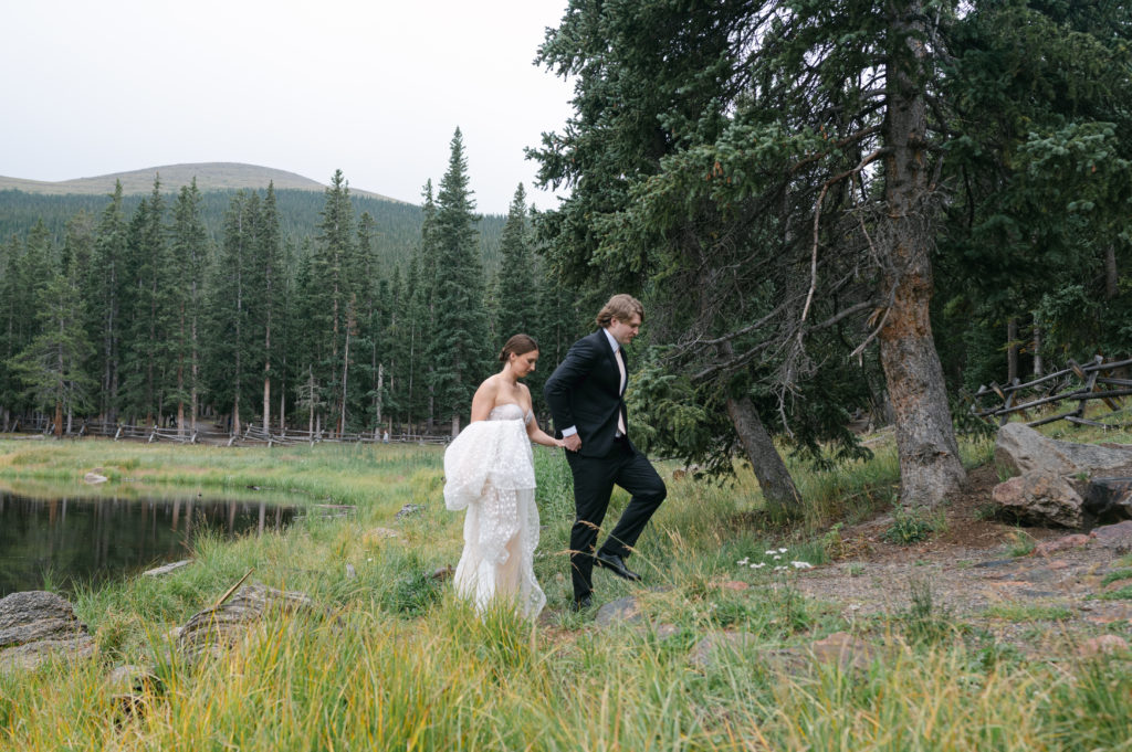 Wedding portraits along the shore of echo lake in Colorado 