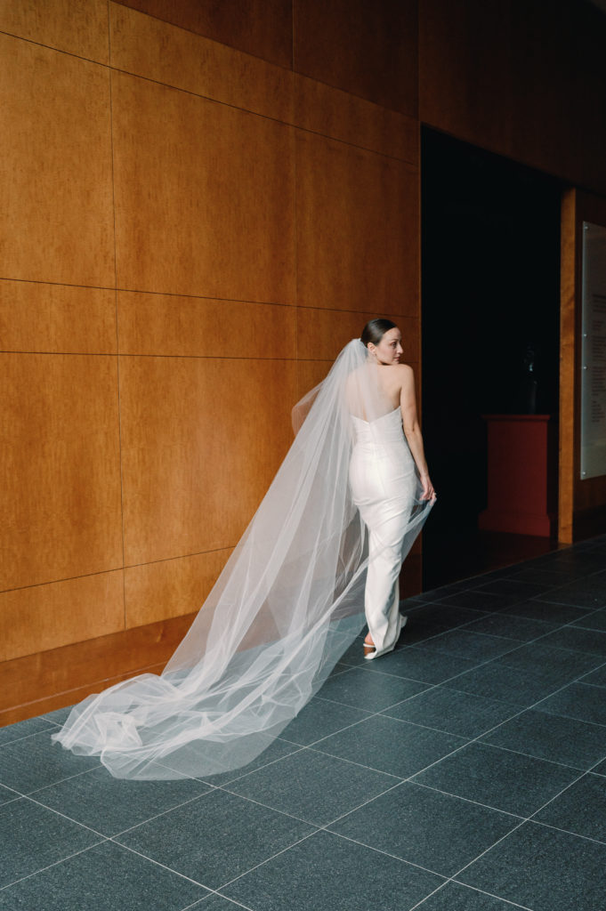 bride walking away from camera during her bridal portrait session 