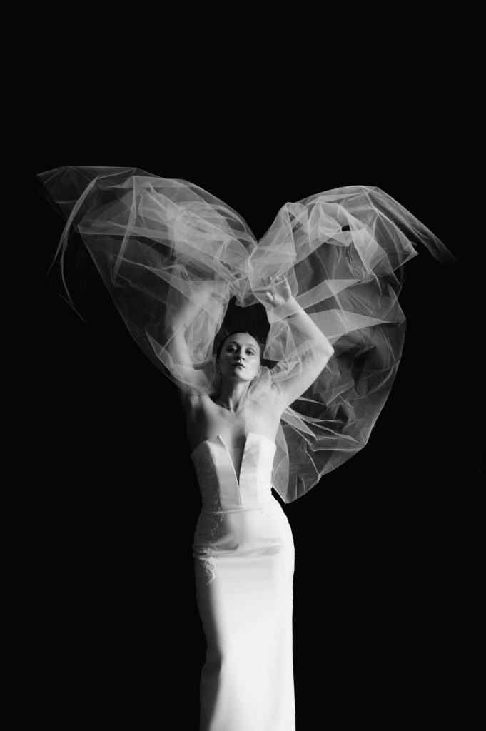 Moody bridal portraits in an art museum in black and white 