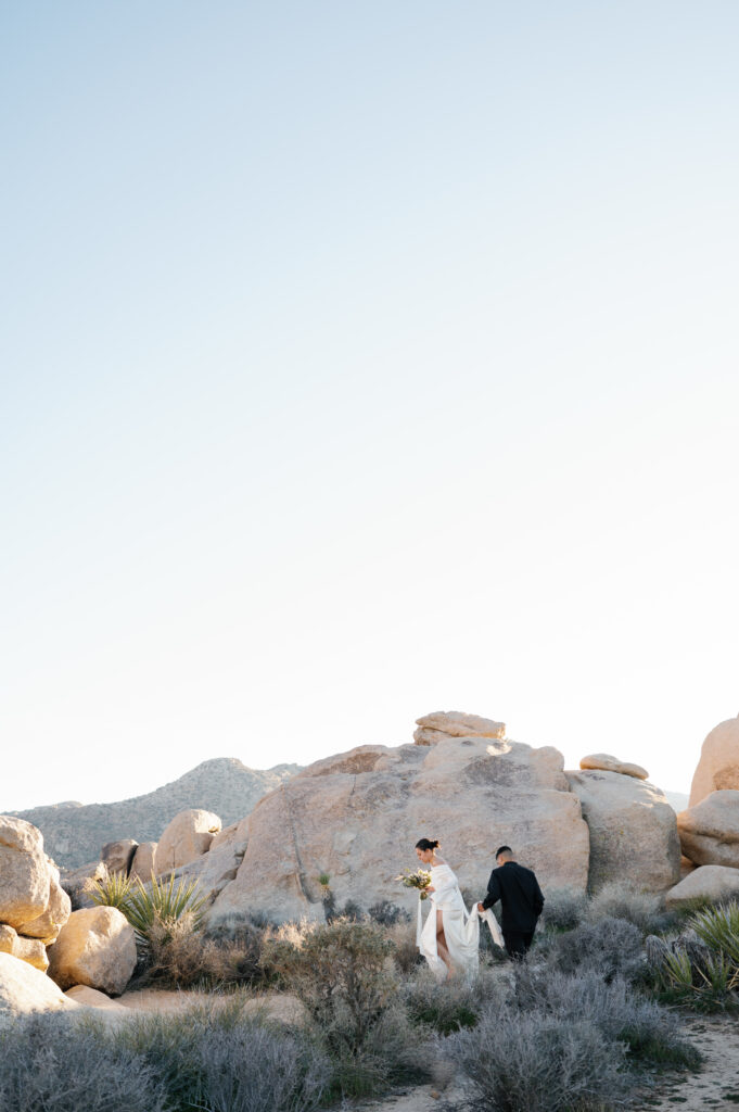 Couple walking in rocks at Joshua Tree