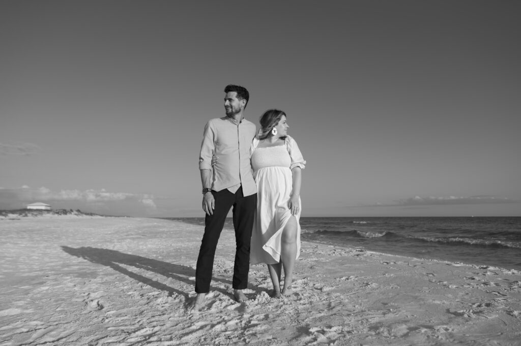 Black and white image of couple posing on Shell Island, Florida 