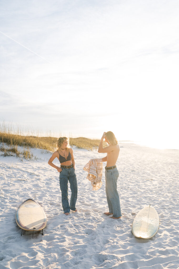 Playful couple at sunrise on the beach in Florida 