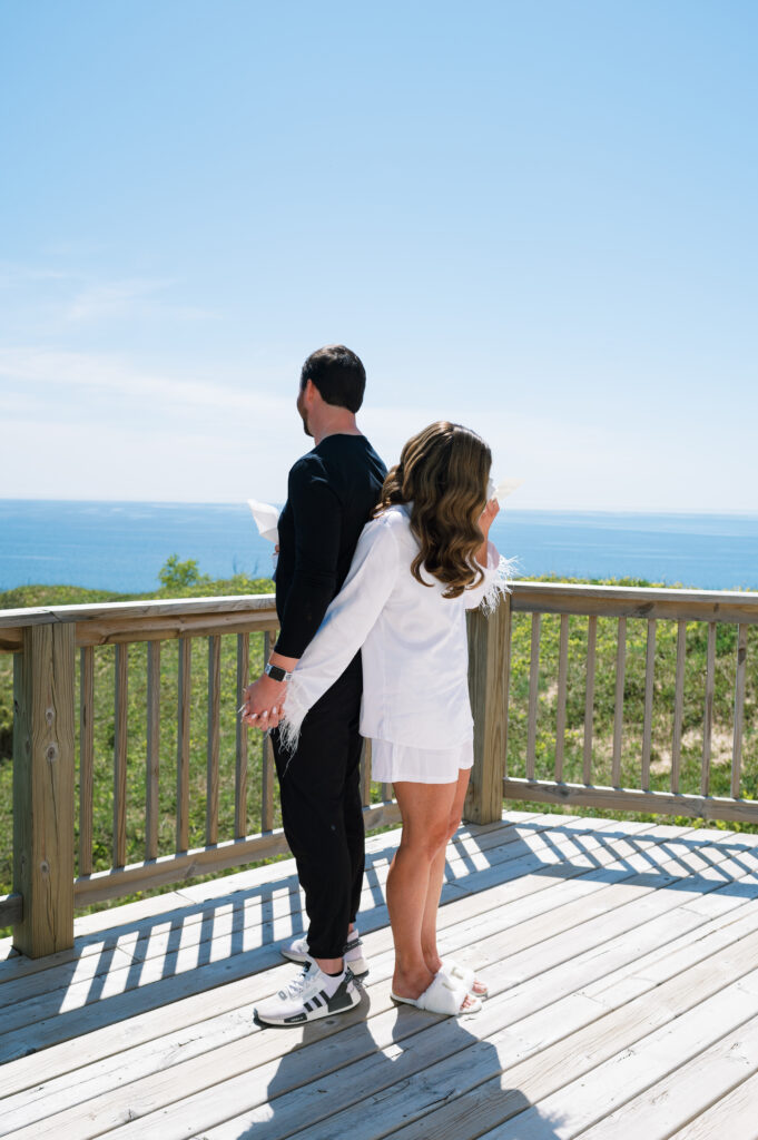 Bride and groom reading private vows to each other with Lake Michigan in the background
