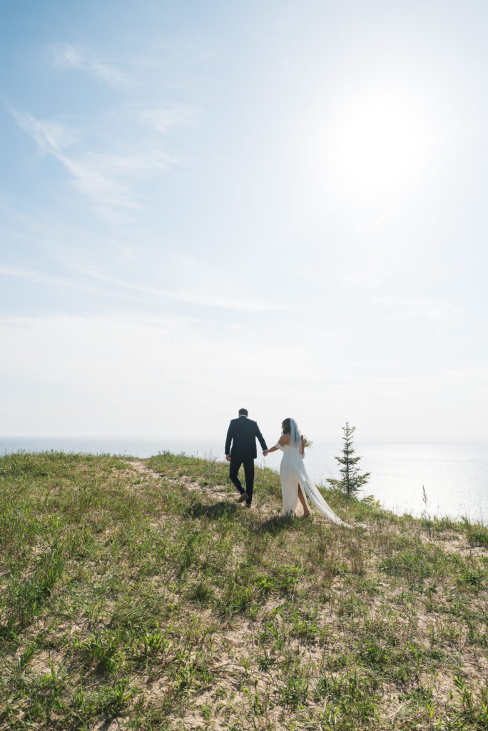 Wedding portrait of bride and groom on the coast of Lake Michigan