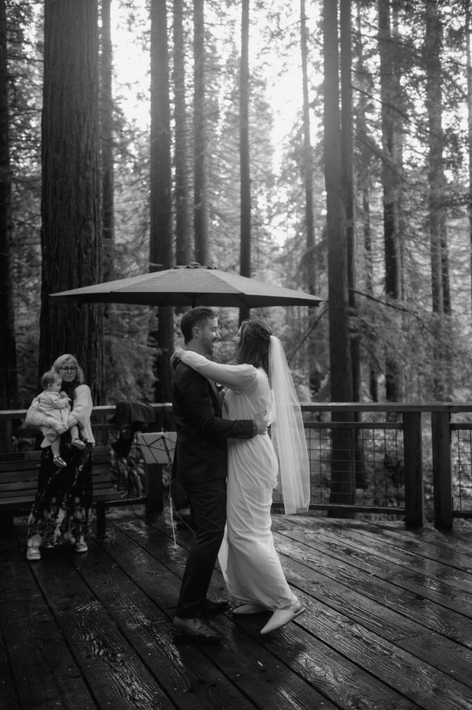 Couples first dance on the Redwood Deck Hoyt Arboretum