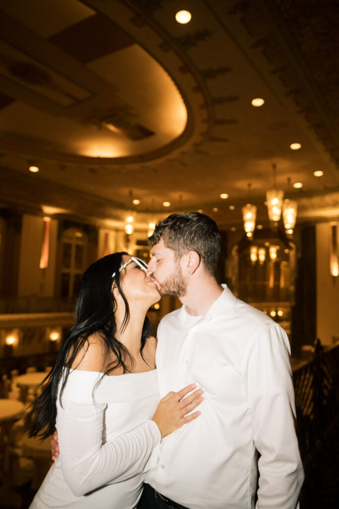 Flash photo of couple kissing from engagement photos in The Hilton Netherlands Plaza in Downtown Cincinnati, OH