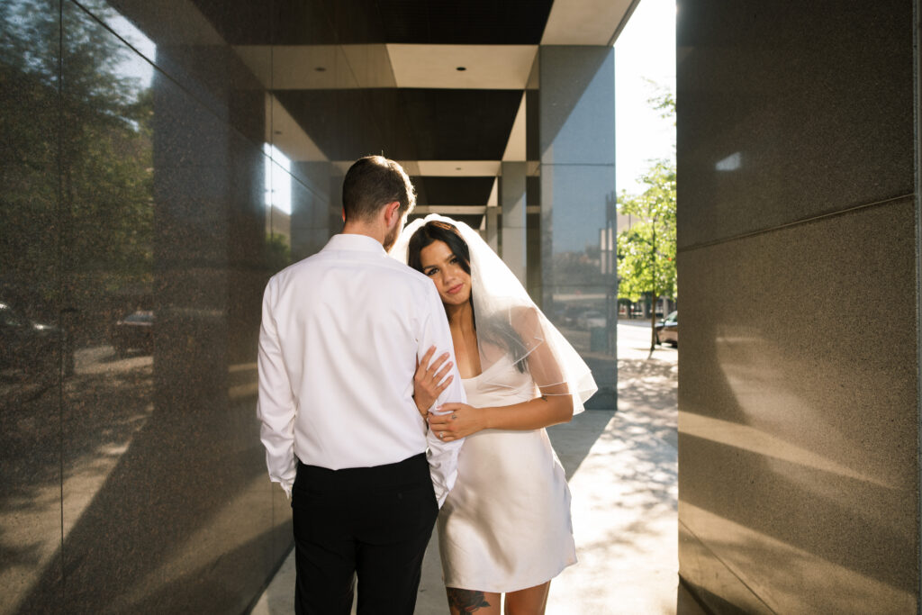 Downtown Cincinnati engagement session with bride in veil and white dress 