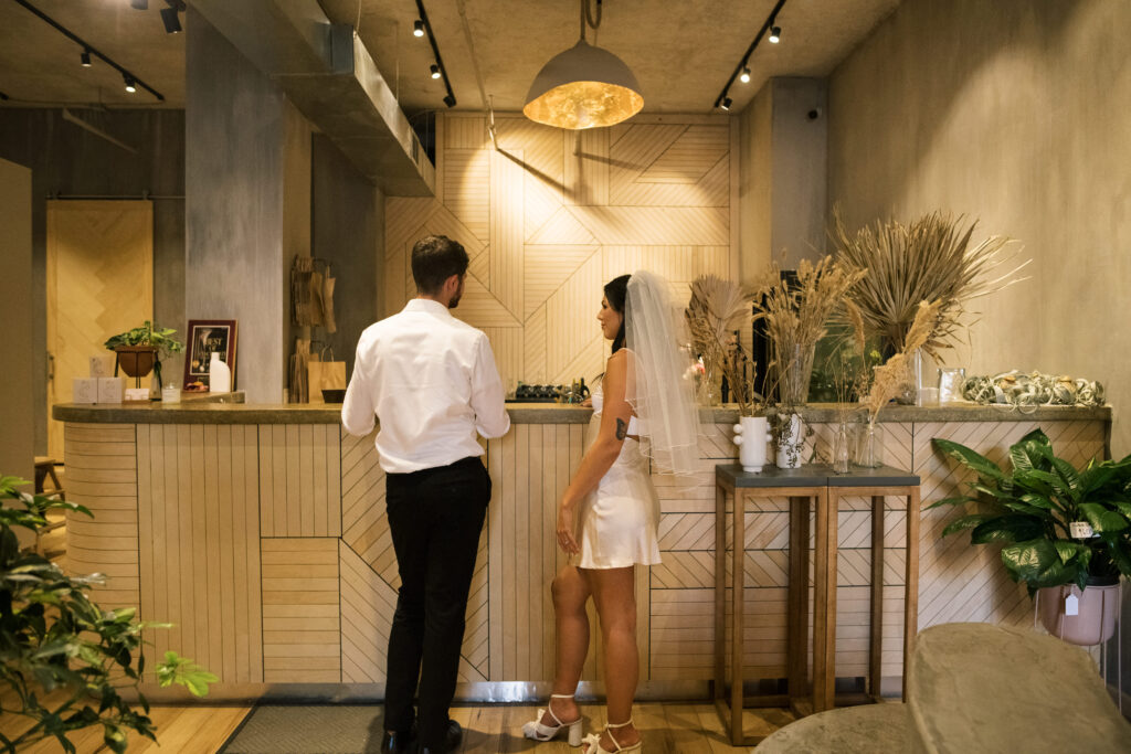 Bride and Groom buying a bouquet at Gia and The Blooms in OTR 