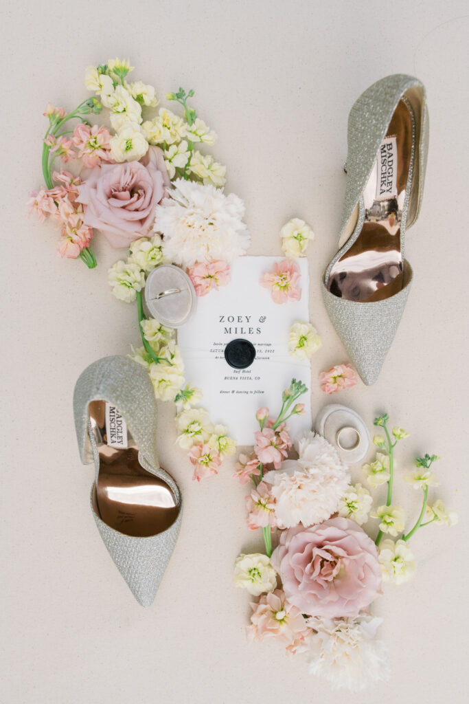 Luxury detail shot of wedding invitation and shoes 