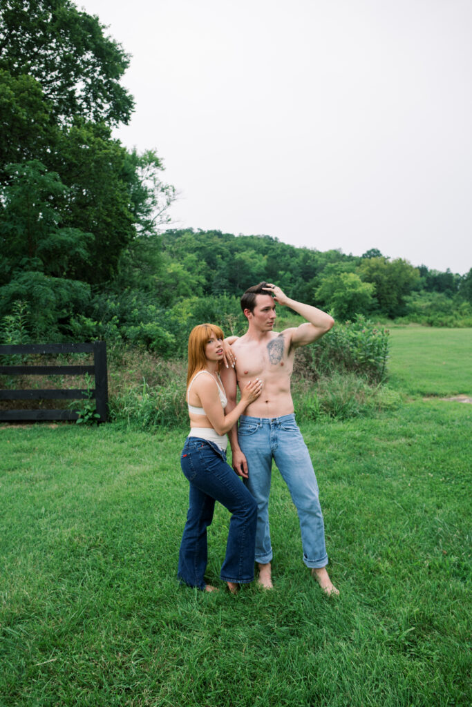 Image of couple posing in a field
