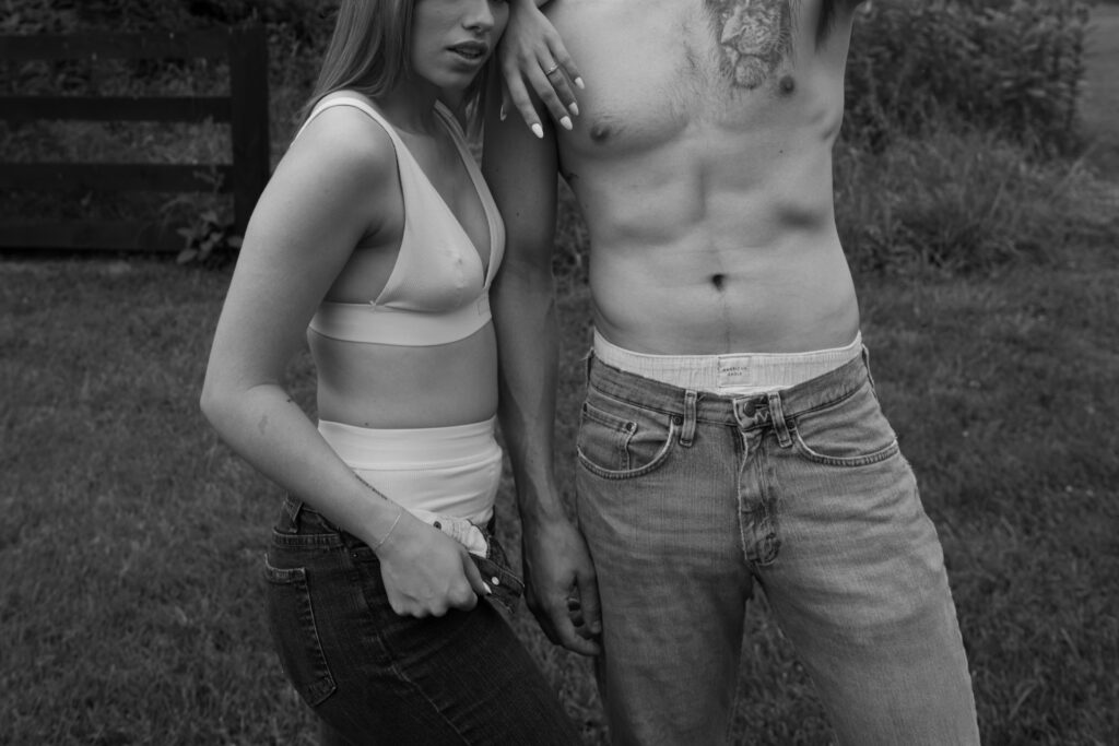 Black and white editorial image of couple in underwear