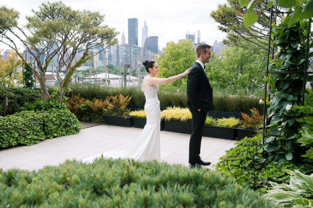 Wedding couples first look at The Foundry in Brooklyn, New York overlooking the skyline