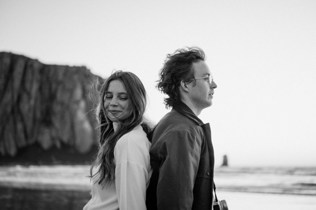Black and white film photo of couple at sunset in Morro Bay 