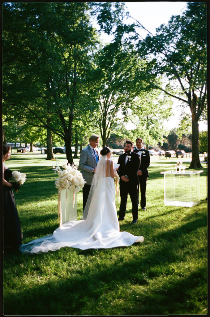 Wedding ceremony on film in the front lawn  at The Estate at Cherokee Dock in Nashville, Tennessee