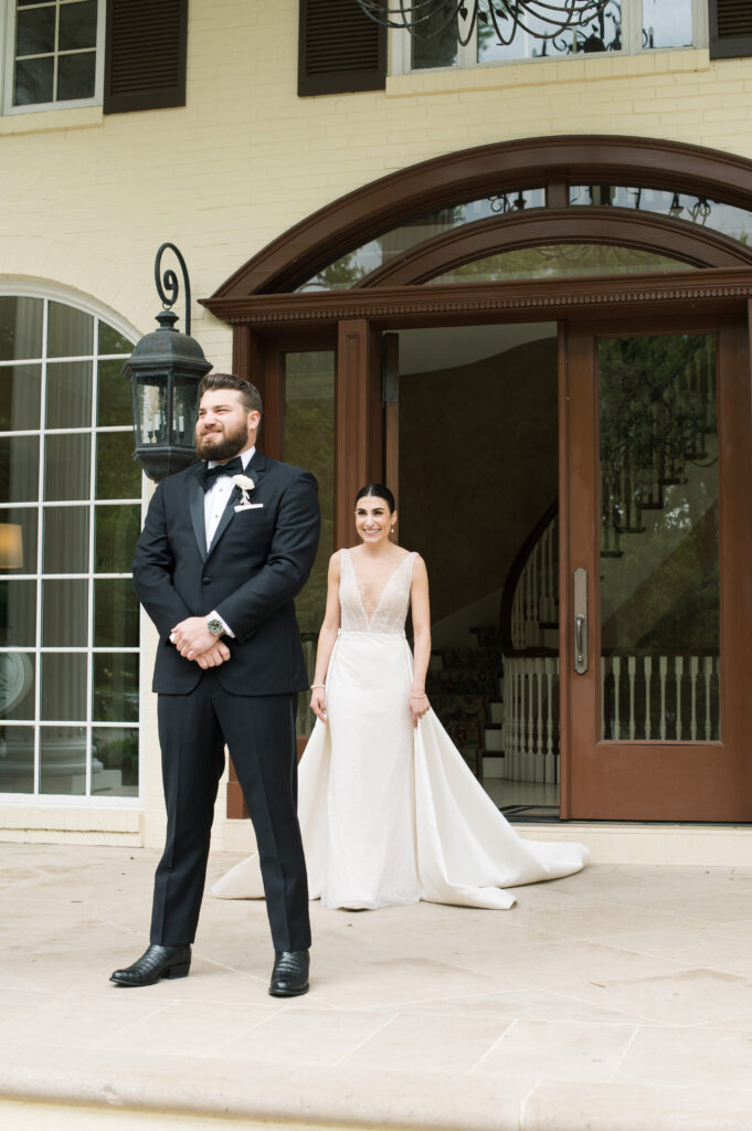 First look with bride and groom on the front porch at The Estate at  Cherokee Dock in Nashville