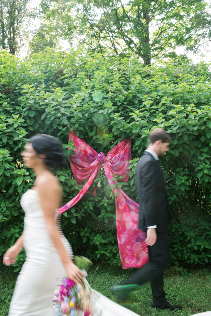 Bride and groom posing on a flower farm in Cincinnati, Ohio at their summertime wedding