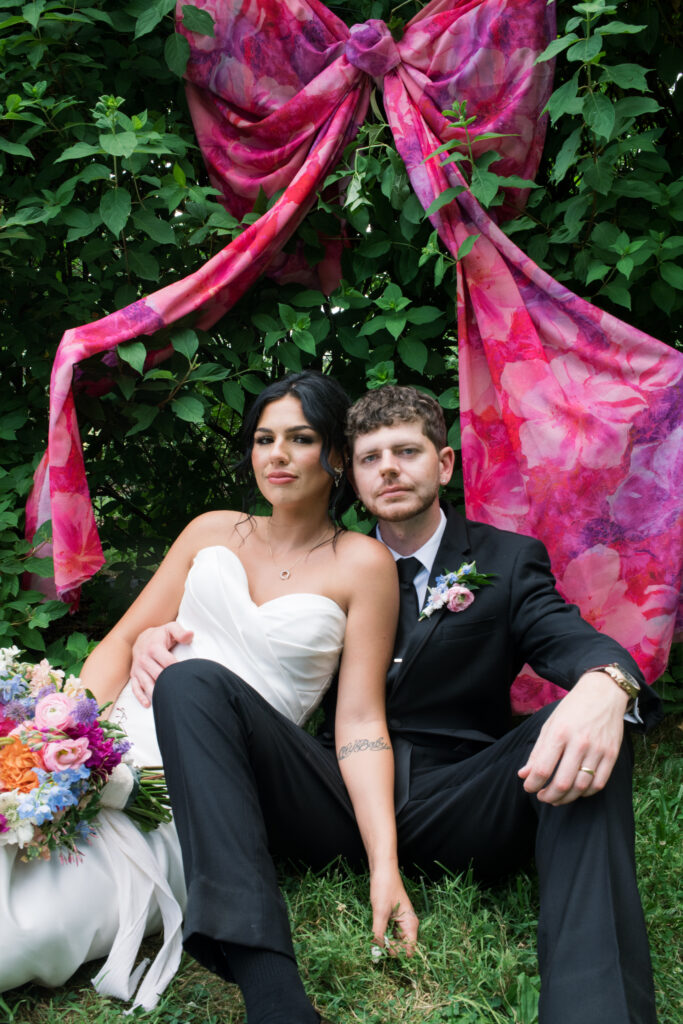 Bride and groom posing on a flower farm in Cincinnati, Ohio at their summertime wedding