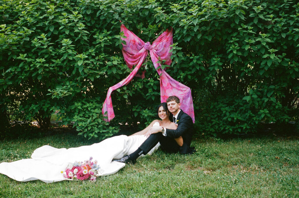 Bride and groom posing on a flower farm in Cincinnati, Ohio at their summertime wedding